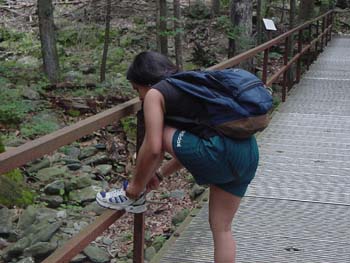 White_Oak_Canyon-Nina_tying_shoe_on_bridge